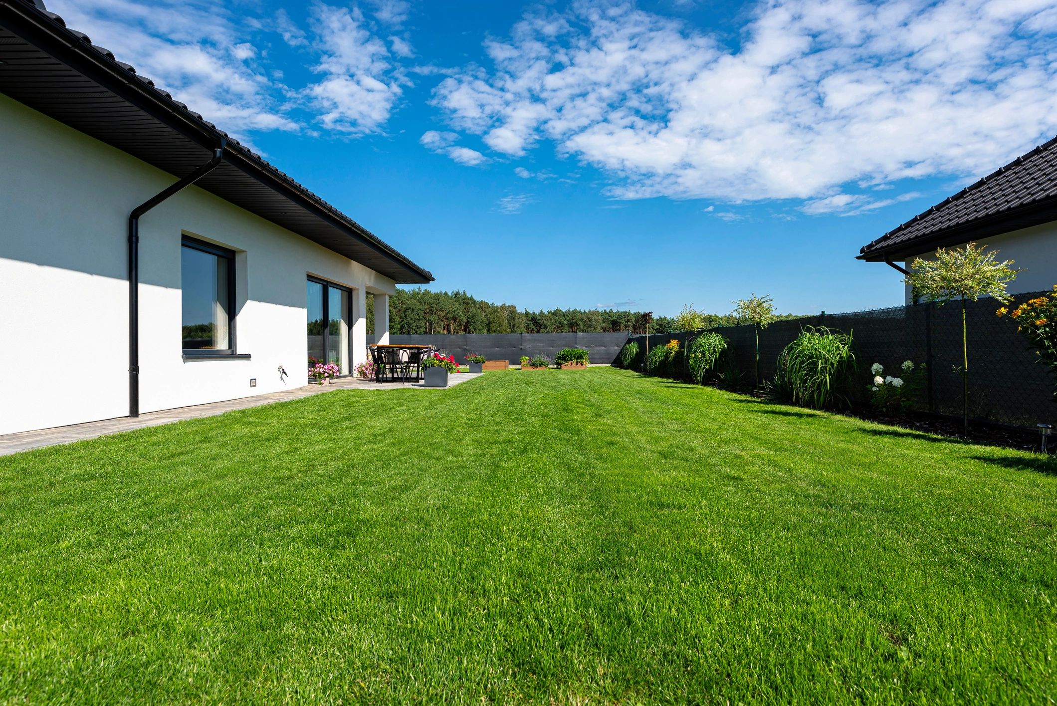 Ontario, Canada home with fresh mulch garden beds and a neatly cut lawn
